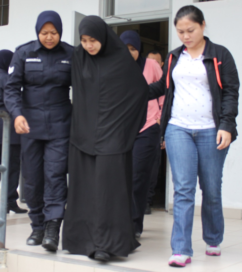 Ummi Kalsom Bahak, 25, was charged with supporting terrorism at the Sepang Sessions Court, October 31, 2014. u00e2u20acu201d Picture courtesy of the Royal Malaysian Police