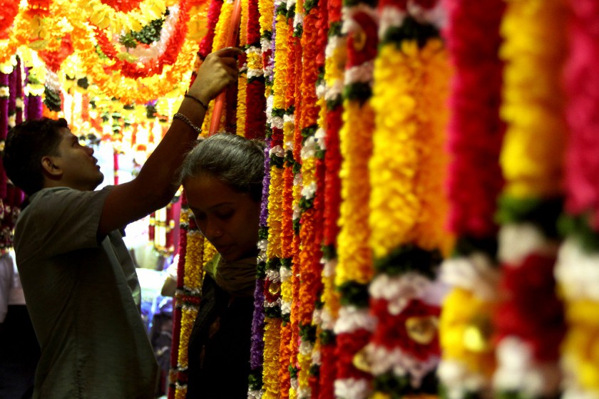 A shopper selecting a flower garland in Little India, Brickfields, Kuala Lumpur, October 17, 2014. u00e2u20acu201d Picture by Yusof Mat Isa