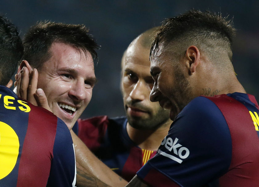 Barcelona's Lionel Messi (left) and Neymar (right) celebrate a goal against Eibar at Camp Nou stadium in Barcelona October 18, 2014. u00e2u20acu201d Reuters pic