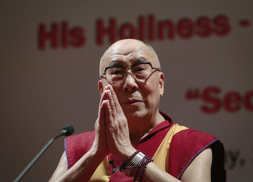 Exiled Tibetan spiritual leader the Dalai Lama gestures during a speech at the 108th anniversary of Indian Merchant Chambers in Mumbai September 18, 2014. u00e2u20acu201d Reuters pic
