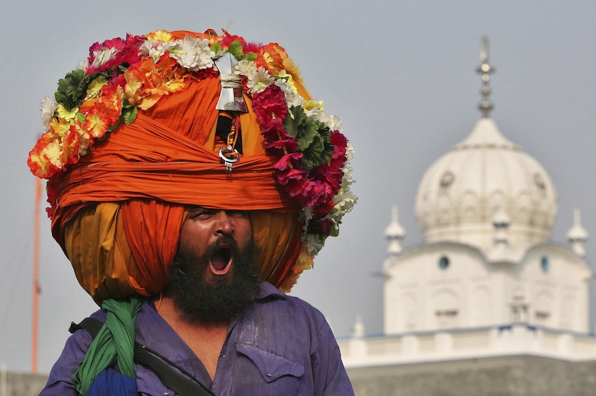 A Nihang or a Sikh warrior, yawns while wearing a turban during a religious procession to mark the Bandi Chhorh Divas in the northern Indian city of Amritsar October 24, 2014. u00e2u20acu201d Reuters pic