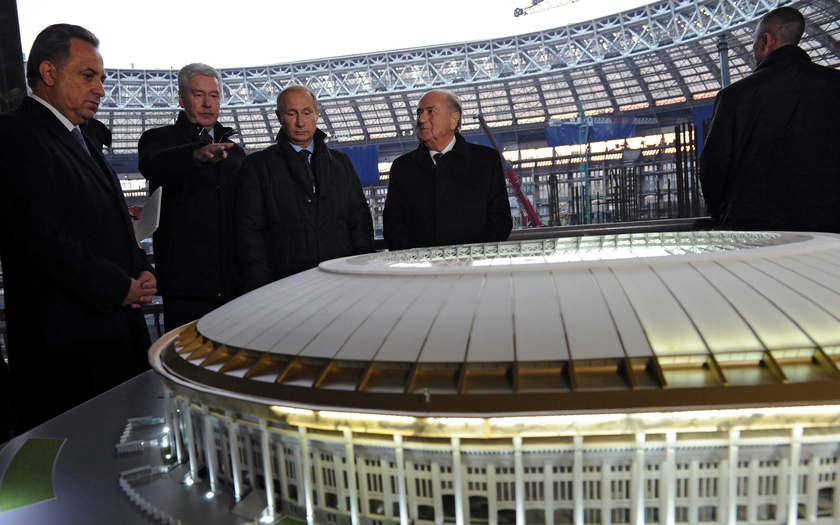 Russia's Sports Minister Vitaly Mutko (left), President Vladimir Putin (centre) and FIFA President Sepp Blatter (second right) listens to Moscow's Mayor Sergei Sobyanin at the Luzhniki Stadium, October 28, 2014. u00e2u20acu201d Reuters picn