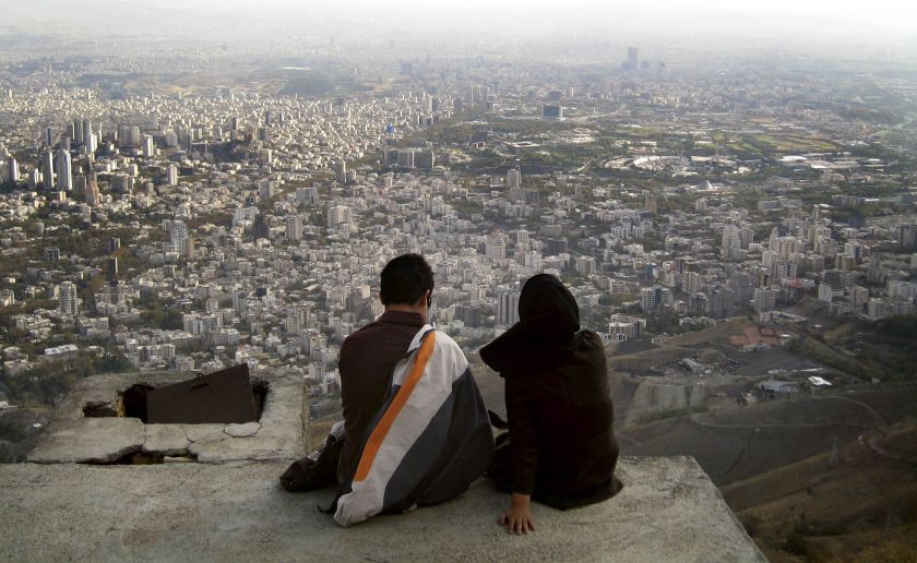 An Iranian couple sit overlooking the city of Tehran, in this October 19, 2006 file photo. The divorce rate in Iran is soaring. u00e2u20acu201d Reuters pic