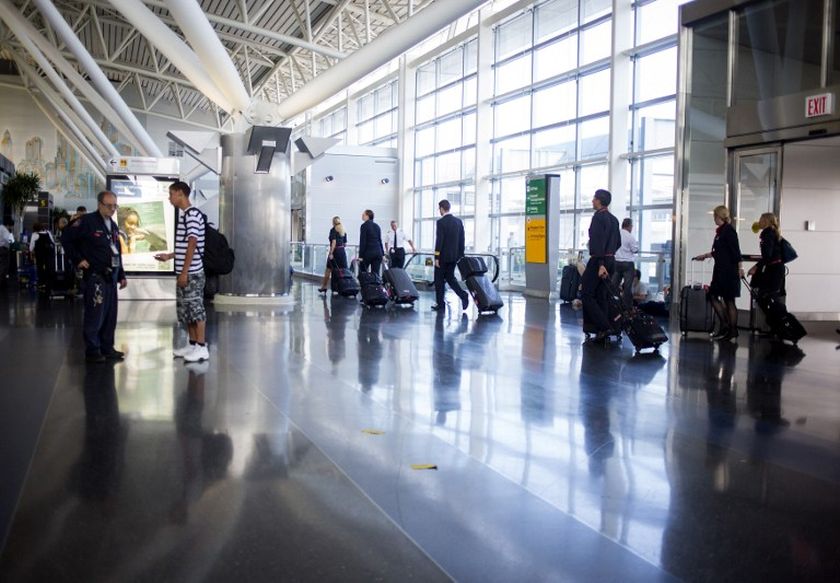 People walk in the American Airlines/US Airways Terminal at John F. Kennedy Airport July 22, 2014 in New York City. u00e2u20acu201d AFP  pic