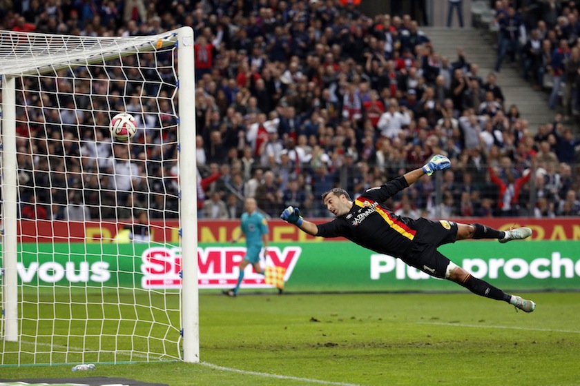 RC Lens' goalkeeper Rudy Riou dives in vain as Paris St Germain's Maxwell scores his team's second goal during their French Ligue 1 match at the Stade de France in Saint-Denis near Paris October 17, 2014. u00e2u20acu201du00c2u00a0Reuters pic
