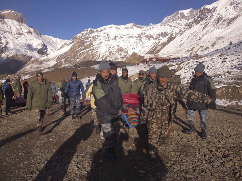 Nepalese army personnel carry a victim rescued from the avalanche at Thorang-La in Annapurna Region in this October 15, 2014 handout photo provided by Nepal Army. u00e2u20acu201d Reuters pic 