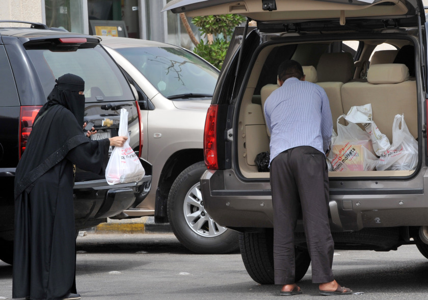 A Saudi woman leaves a mall after shopping in Riyadh, on March 29, 2014. Saudi activists have urged women to defy a traditional driving ban and get behind the wheel. u00e2u20acu201d AFP