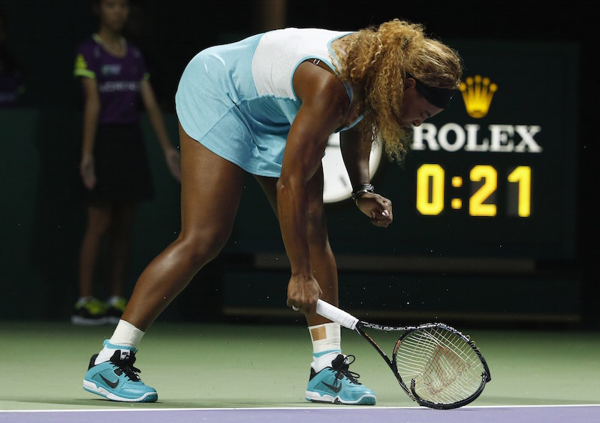 Serena Williams of the US smashes her second racquet during her WTA Finals singles semi-finals tennis match against Caroline Wozniacki of Denmark, at the Singapore Indoor Stadium October 25, 2014. u00e2u20acu201d Reuters pic