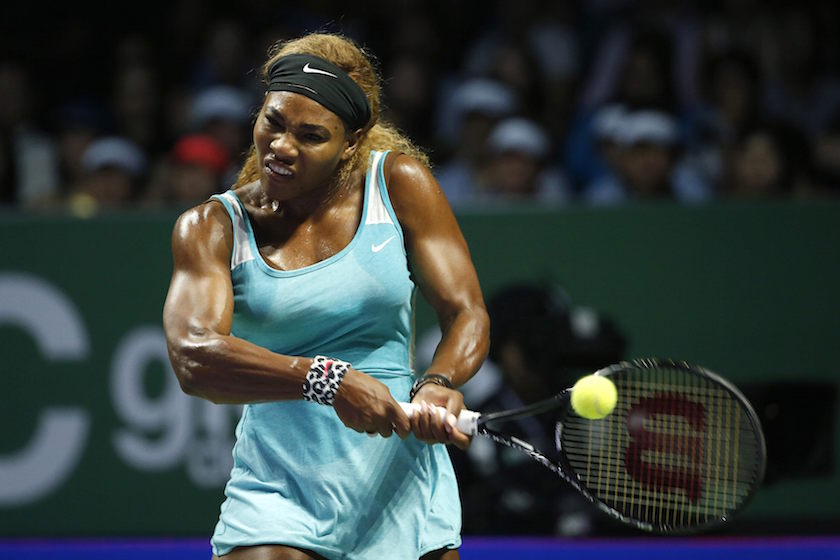 Serena Williams of the US hits a return to Simona Halep of Romania during their womenu00e2u20acu2122s singles final tennis match of the WTA Finals at the Singapore Indoor Stadium October 26, 2014. u00e2u20acu201d Reuters pic