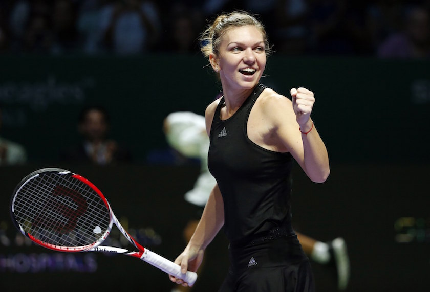 Simona Halep of Romania celebrates her win over Agnieszka Radwanska of Poland during their WTA Finals singles semi-finals tennis match at the Singapore Indoor Stadium October 25, 2014. u00e2u20acu201d Reuters pic