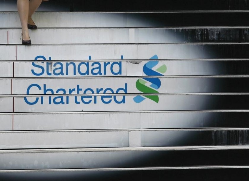 A woman walks down the stairs of the Standard Chartered headquarters in Hong Kong in this October 13, 2010 file photo. u00e2u20acu201d Reuters pic