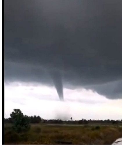 A screengrab from a YouTube video posted online shows the rare cyclone that swept through Pendang, Kedah this evening, leaving at least 10 homes and a primary school destroyed in its wake.  