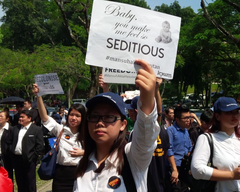 The crowd holding anti-sedition placards at the ‘Walk for Peace and Freedom’ march. 