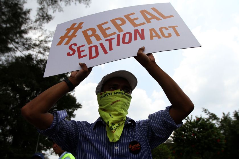 A protester is seen holding the ‘Repeal the Sedition Act’ placard during the ‘Walk for Peace and Freedom’ march, October 16, 2014. ― Picture by Yusof Mat Isa 