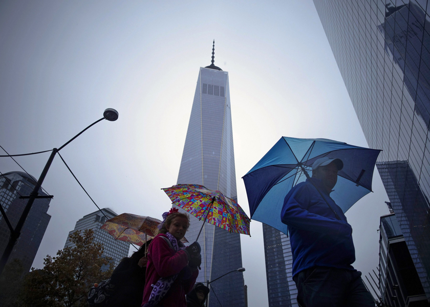 Pedestrians stream past the new One World Trade Centre in downtown New York City, November 16, 2014. u00e2u20acu201d Reuters pic