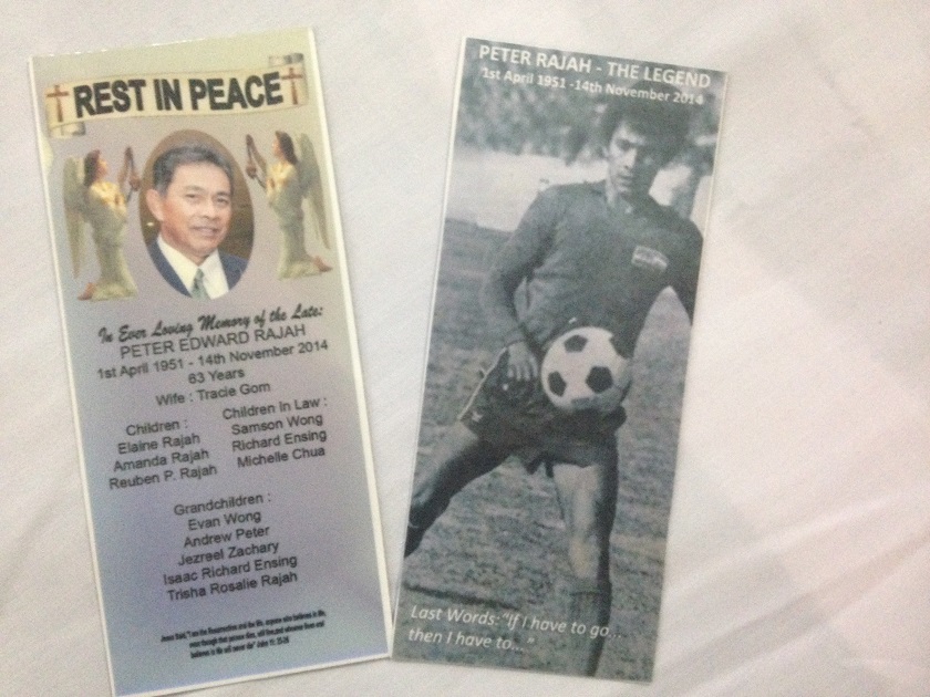 Bookmarks bearing the former goalieu00e2u20acu2122s face and of his youth were distributed at the funeral service for the late Peter Rajah at St Michaelu00e2u20acu2122s Catholic Church in Penampang, Sabah, November 17, 2014. u00e2u20acu201d Picture by Julia Chan 