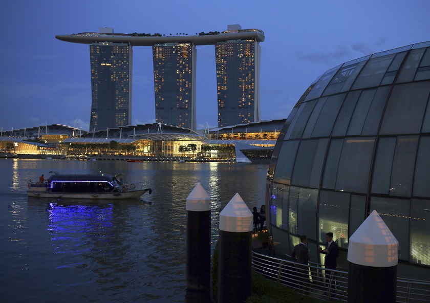 Patrons drink at a restaurant overlooking the Marina Bay Sands integrated resort in the financial district of Singapore, November 20, 2014. u00e2u20acu201d Reuters pic