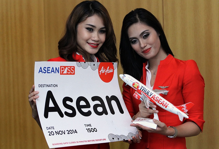 Models pose with AirAsiau00e2u20acu2122s latest offering, the Asean Pass which provides a 10-flight pass at a flat rate of RM499 and a 20-flight pass that is expected to cost under RM1,000 at the KL Hilton in Kuala Lumpur, November 20, 2014. u00e2u20acu201d Picture by Yusof Mat 
