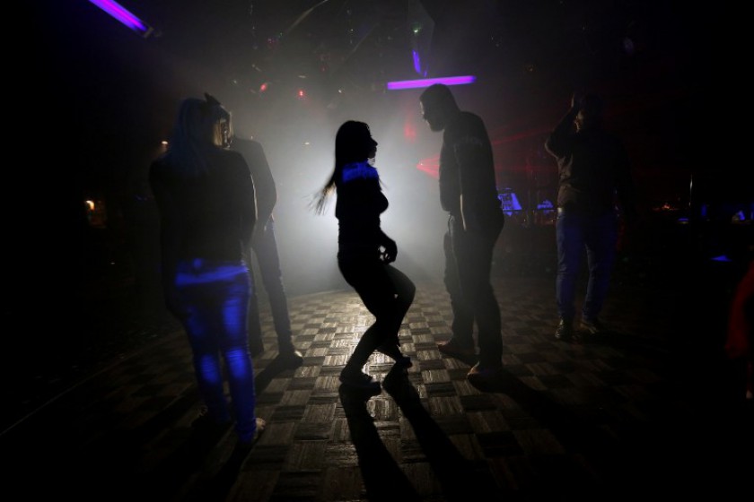 A file picture taken on November 15, 2014, shows Syrians dancing at a nightclub in the government-controlled part of the northern city of Aleppo. u00e2u20acu201d AFP pic
