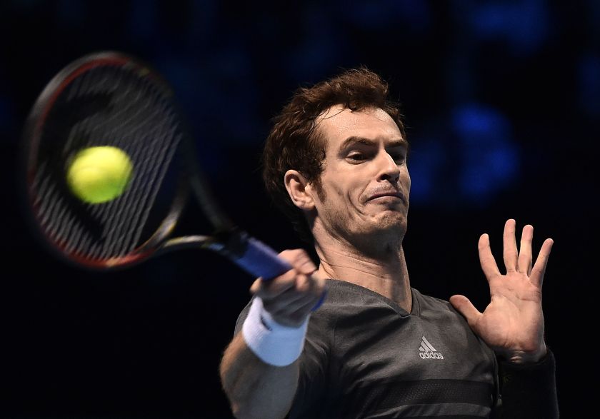 Andy Murray of Britain returns the ball against Milos Raonic of Canada during their tennis match at the ATP World Tour finals at the O2 Arena in London November 11, 2014.. u00e2u20acu201d Reuters pic