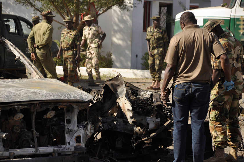 Bomb experts investigate the site of an explosion at a police station in Kano, Nigeria November 15, 2014, believed to be a Boko Haram suicide bombing. u00e2u20acu201d Reuters pic