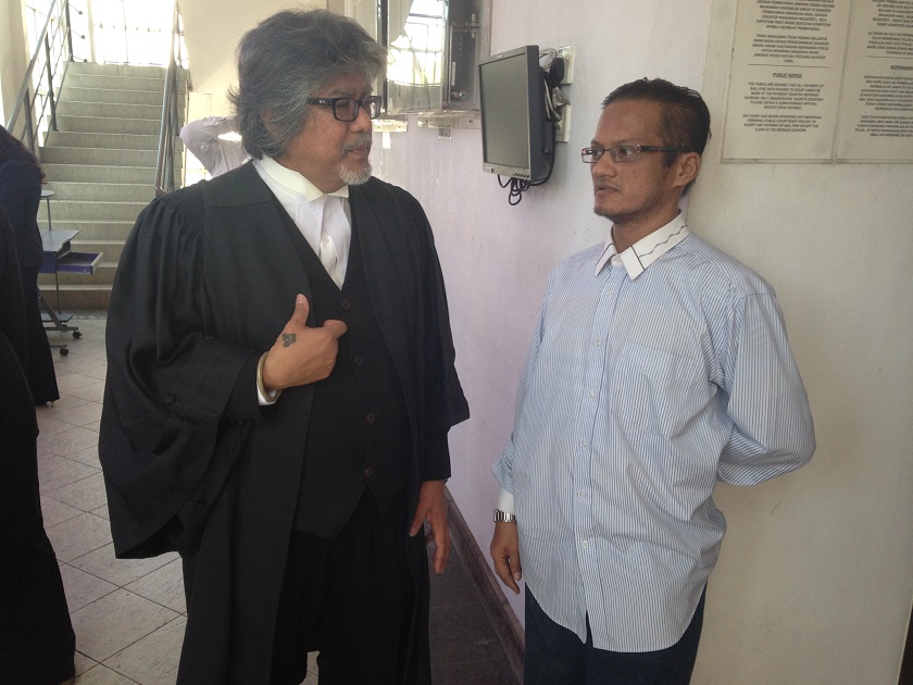 nConvicted child rapist Riduan Masmud (right) will know on January 5 if his appeal to overturn his conviction will be granted, November 18, 2014. u00e2u20acu201d Picture by Julia Chann
