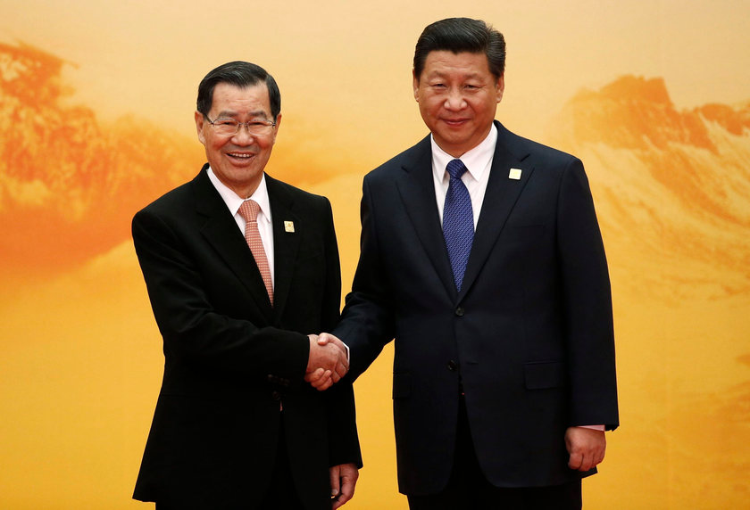 Taiwan's envoy to the Apec forum Vincent Siew shakes hands with China's President Xi Jinping in Beijing, November 11, 2014, a display of much improved relations between the two sides. u00e2u20acu201d Reuters pic