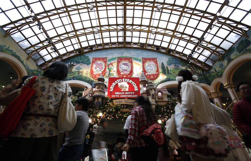 People walk past a statue of Hello Kitty on her 40th birthday at the entrance of Sanrio Puroland theme park in Tokyo November 1, 2014. u00e2u20acu201d Reuters pic