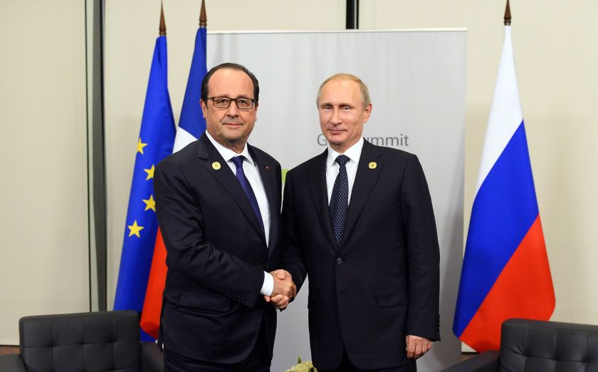 France's President Francois Hollande (left) shakes hands with Russia's President Vladimir Putin during their meeting on the sidelines of the G20 summit in Brisbane November 15, 2014. u00e2u20acu201d Reuters pic