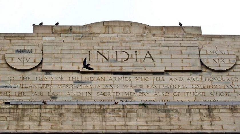 A bird flies past as an inscription honouring fallen Indian soldiers, who lost their lives during World War I, is seen on the India Gate monument in New Delhi on August 4, 2014. u00e2u20acu201d AFP pic