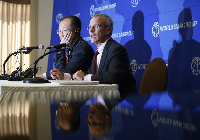 World Bank Group president Jim Yong Kim (left) listens to a reporter's question during a news conference in Seoul November 4, 2014. u00e2u20acu201d Reuters pic