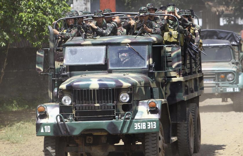 Soldiers ride in a military truck as they are deployed to remote villages in Jolo, Sulu southern Philippines October 17, 2014. u00e2u20acu201d Reuters pic