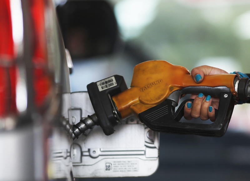 A worker at state-owned Pertamina, the country's main retailer of subsidised fuel, fills a vehicle at a petrol station in Jakarta November 17, 2014. u00e2u20acu201d Reuters pic