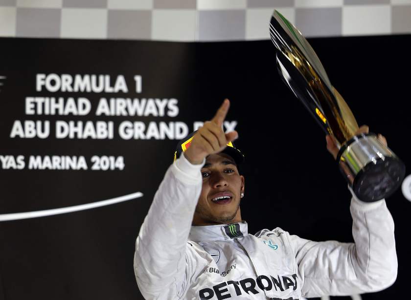 Mercedes Formula One driver Lewis Hamilton of Britain celebrates on the podium after winning the Abu Dhabi F1 Grand Prix at the Yas Marina circuit in Abu Dhabi, November 23, 2014. u00e2u20acu201d Reuters pic 