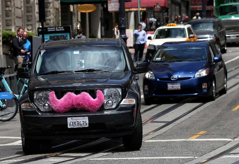 A Lyft car drives along a street in San Francisco, June 12, 2014. u00e2u20acu201d AFP pic n