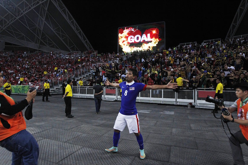 Malaysiau00e2u20acu2122s Safiq Rahim celebrates after converting a penalty kick to score 2-1 against Singapore during their Suzuki Cup Group B match at the National Stadium in Singapore November 29, 2014. u00e2u20acu201d Reuters pic
