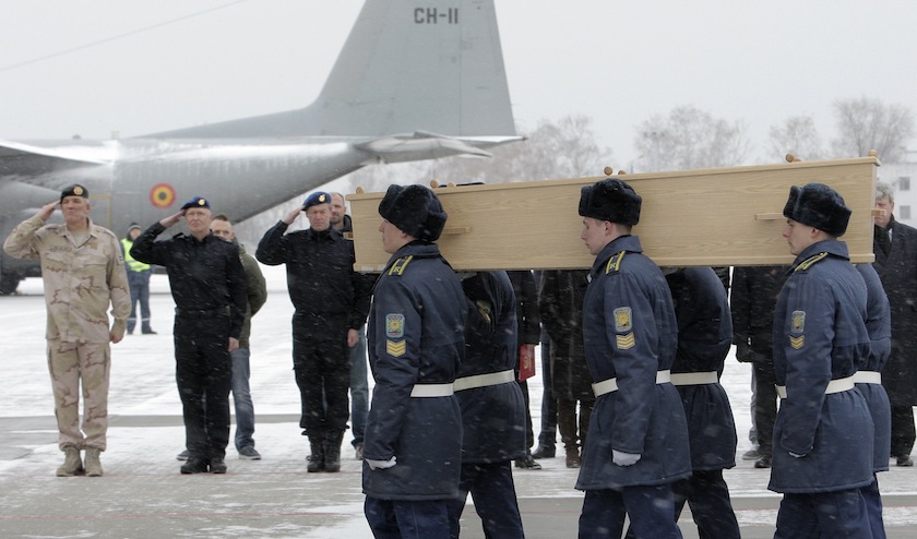 Participants carry a coffin during a farewell ceremony as some of the remains of the victims of Malaysia Airlines flight MH17 are loaded on to a transport plane before it heads to the Netherlands, at Kharkiv airport November 28, 2014. u00e2u20acu201d Reuters pic