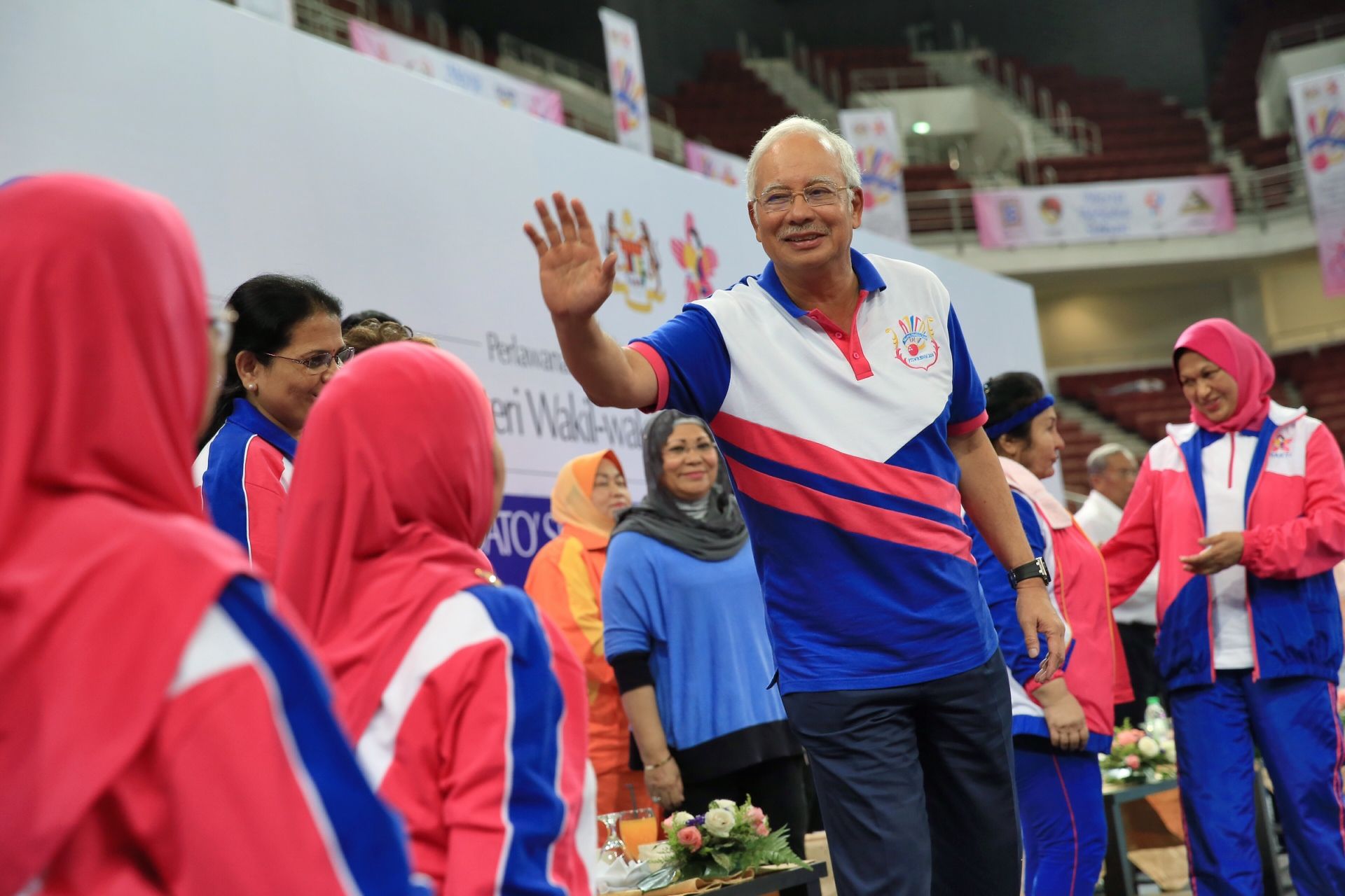 Prime Minister, Datuk Sri Najib Razak (left) waves to the crowd a the annual badminton competition organized by Bakti in Putra Stadium, Bukit Jalil, November 8, 2011. u00e2u20acu201d Picture by Saw Siow Feng