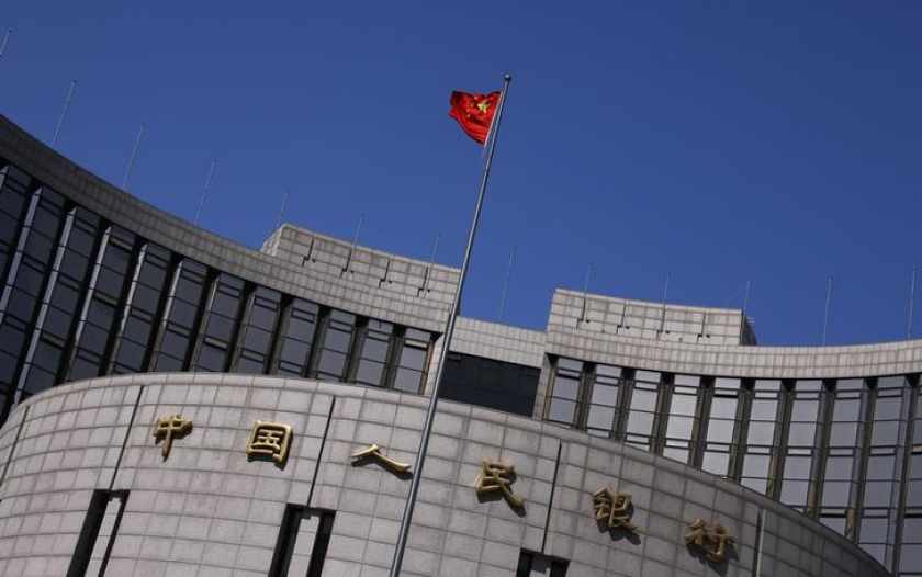 A Chinese national flag flutters outside the headquarters of the People's Bank of China, the Chinese central bank, in Beijing, April 3, 2014. u00e2u20acu201d Reuters pic 