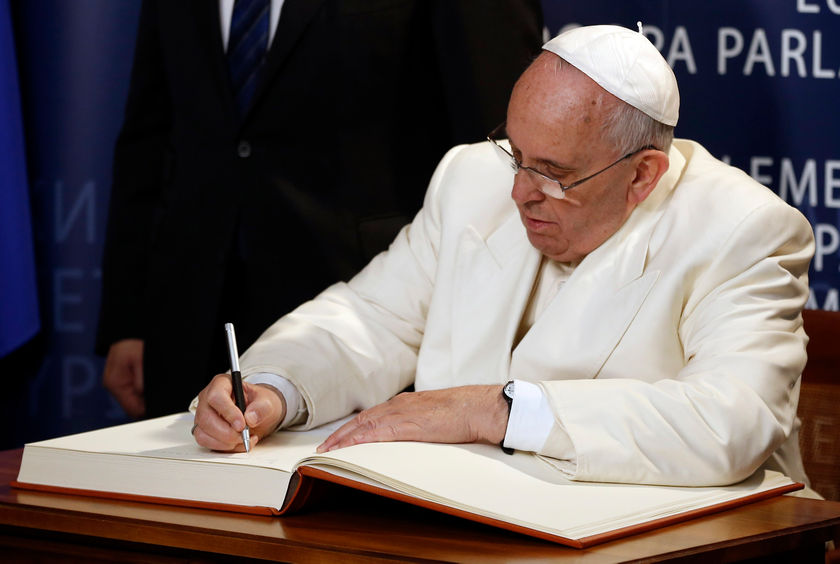 Pope Francis signs the golden book during a ceremony at the European Parliament in Strasbourg, eastern France November 26, 2014. u00e2u20acu201d Reuters pic