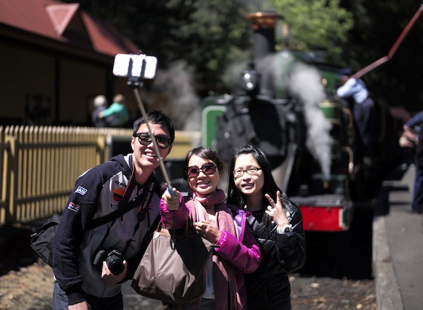 Tourists take a 'selfie' picture in front of Puffing Billy steam engine 6A during a water stop at Lakeside station near Melbourne, October 20, 2014. u00e2u20acu201du00c2u00a0Reuters pic