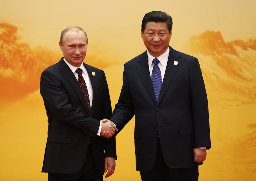 Russiau00e2u20acu2122s President Vladimir Putin (left) shakes hands with Chinau00e2u20acu2122s President Xi Jinping during the Asia Pacific Economic Cooperation (APEC) summit in Beijing, November 11, 2014. u00e2u20acu201d Reuters pic
