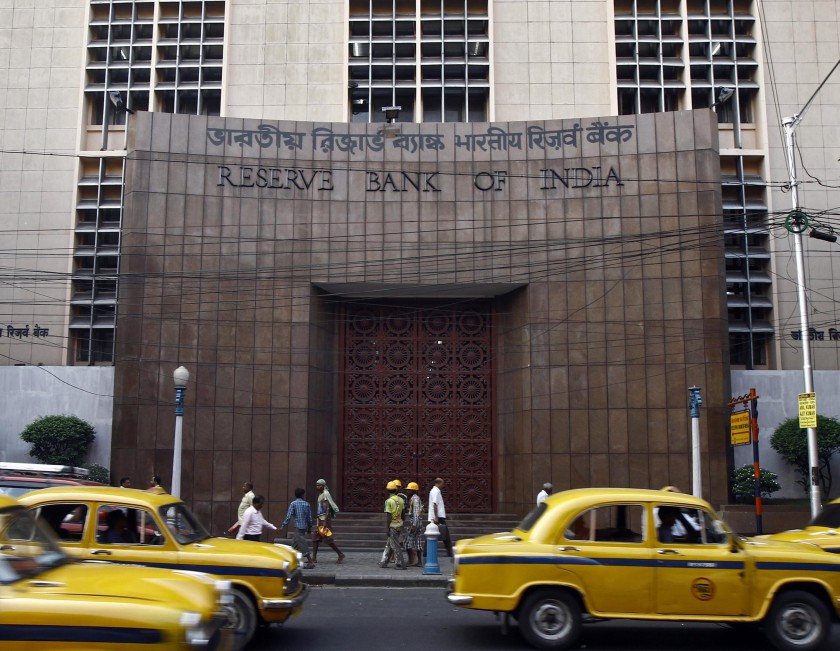 Commuters travel past a Reserve Bank of India (RBI) building in Kolkata November 11, 2014.  u00e2u20acu201d Reuters pic
