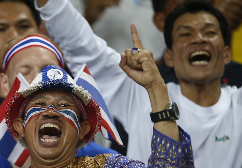 A Thai supporter cheers at the end their Suzuki Cup Group B match against Singapore at National Stadium in Singapore November 23, 2014. Thailand beat Singapore 2-1. u00e2u20acu201du00c2u00a0Reuters pic