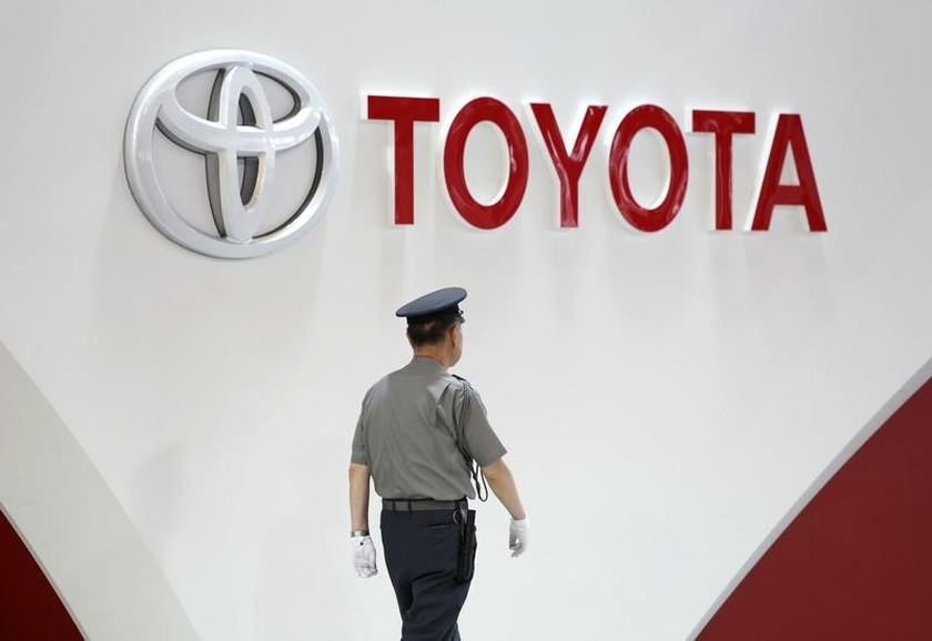 A security guard walks under the logo of Toyota Motor Corp at the company's showroom in Tokyo June 17, 2014. u00e2u20acu201d Reuters picn