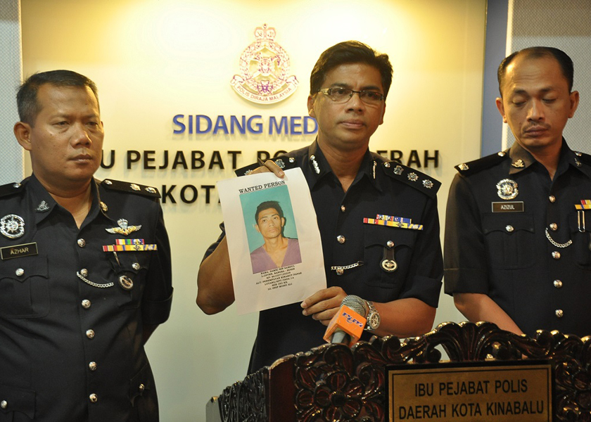 City police chief ACP M Chandra showing the picture of the suspect at a press conference this morning, December 19, 2014. u00e2u20acu201d Picture by Julia Chan