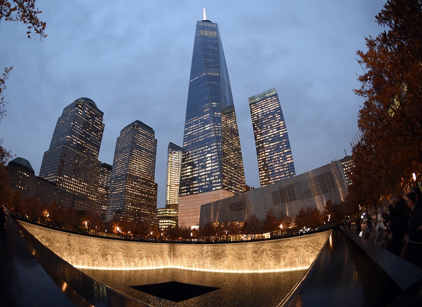 One World Trade Centre raises high above a reflecting pool November 13, 2014 in New York. u00e2u20acu201d AFP pic