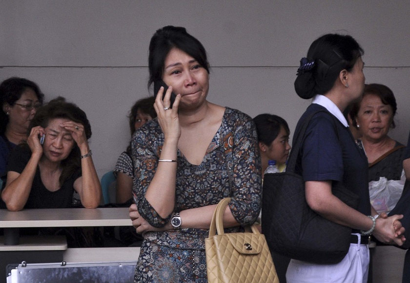 Family members of passengers on board AirAsia flight QZ8501 wait for information inside the AirAsia crisis centre at Juanda Airport in Surabaya, East Java December 28, 2014. u00e2u20acu201d Reuters pic