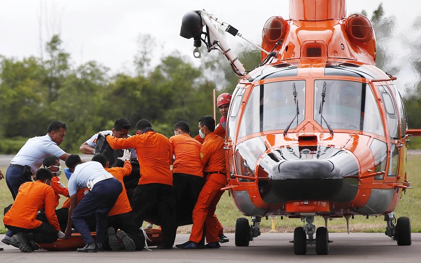 Indonesian Search and Rescue crews unload one of two bodies of AirAsia passengers recovered from the sea at the airport in Pangkalan Bun, central Kalimantan, December 31, 2014. u00e2u20acu201d Reuters pic