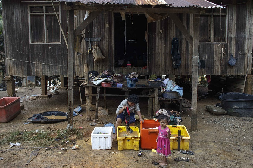 Residents clean out their personal belongings after their house was flooded at Kuala Krai in Kelantan December 30, 2014. u00e2u20acu201d Reuters pic